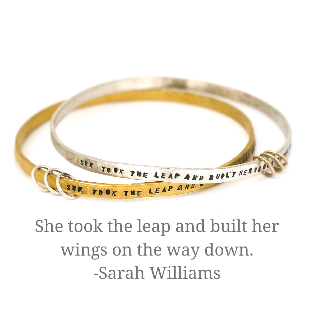 "She took the leap and built her wings on the way down" - three ring bangle