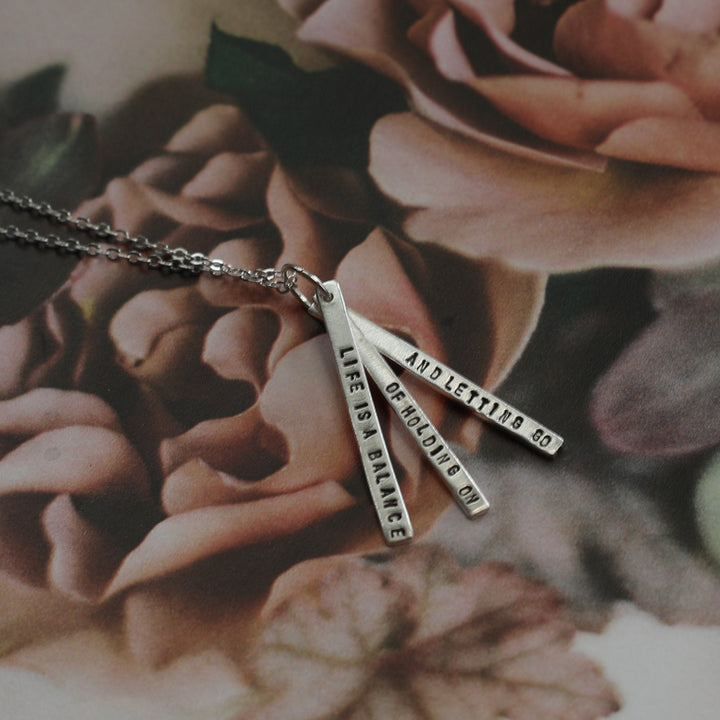 "Life is a balance of holding on and letting go" -Rumi Quote Necklace